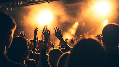 generic concert photo with band and crowd